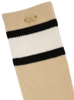 Beżowe skarpety z bawełny ozdobione złotym monogramem